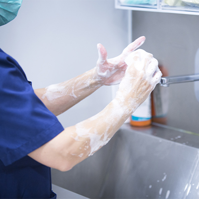 Surgeon washing hands properly.